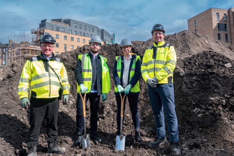 Left to right on site are Graham project manager Martin Boyle, Unite commercial manager Ben Pusey and project manager Vicky King, and Graham pre-construction director Anthony Bateman