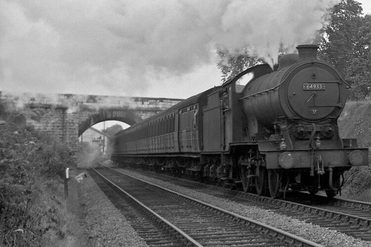 A steam train passes under Rudgate bridge in 1957, heading towards Tadcaster (Credit: The Transport Treasury Ltd (MM292))