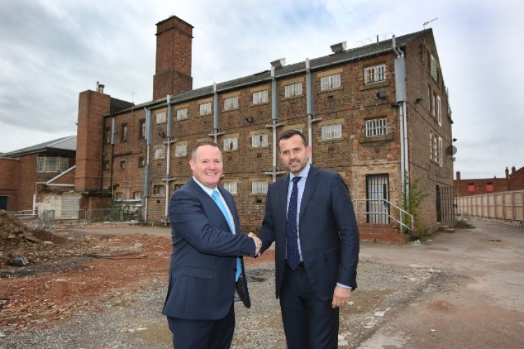 Hambleton District Council chief executive Justin Ives, left, and Wykeland managing director Dominic Gibbons shake on the deal at Northallerton Prison