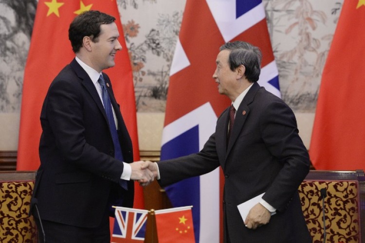 Chancellor George Osborne shakes hands with the deputy head of China&rsquo;s National Energy Administration and Vice Premier of the State Council, Ma Kai