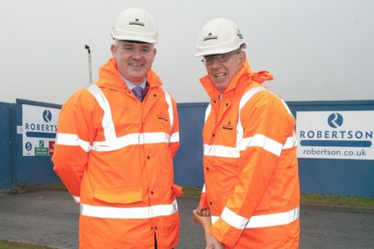 Robertson regional md Martin Smith and NHSGGC chairman Andrew Robertson cut the first sod