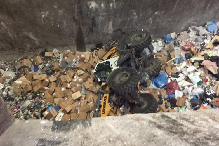 Photo of telescopic handler in the waste pit, courtesy of West Midlands Fire Service
