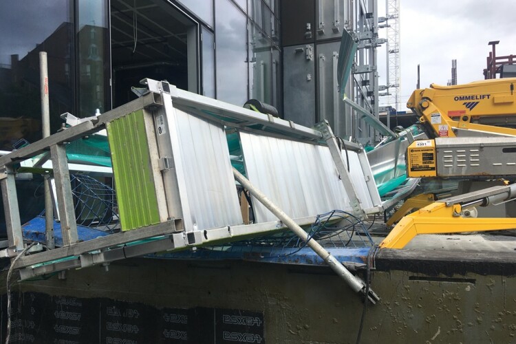 Two men were in the suspended access cradle when it collapsed 