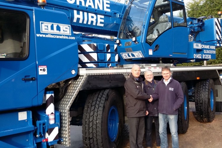 Andy Cahill of Manitowoc Cranes (left) with Bill and Simon Ellis of Ellis Crane Hire in front of the GMK3060