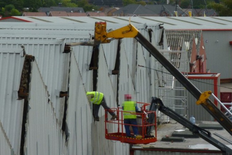 Unsafe work on the roof of a large furniture store in Bridgtown, Cannock