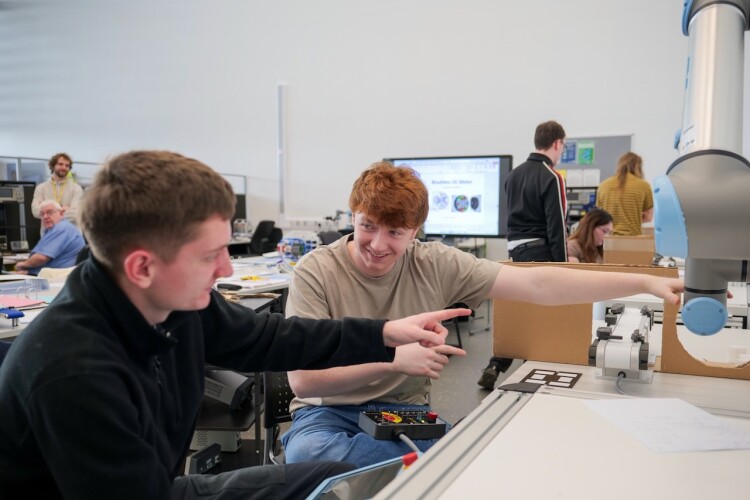 Students trying out the robotics training equipment at the facility in West Cumbria. Photo by UKAEA.