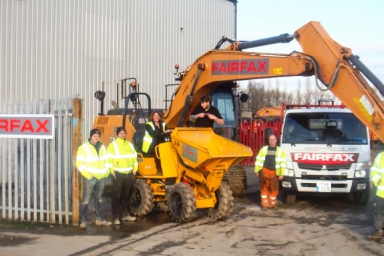 Depot manager Claire Craven, seated on the dumper, and some of her team