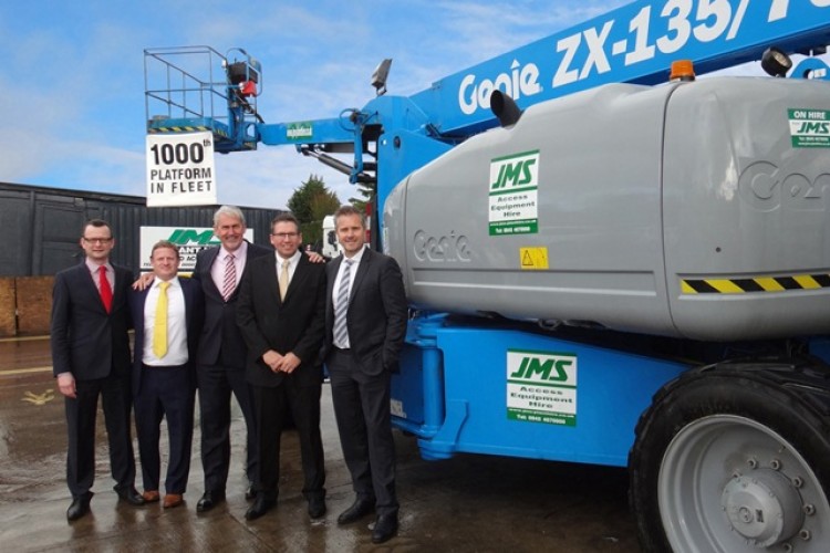 Jim Daintith of APS, centre, hands over the Genie ZX-135/70 to the JMS team of (left to right) Justin Lynn, Mike Howells, Mark Jackson and Les Warren.