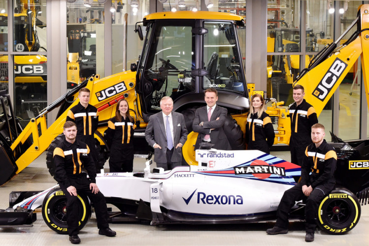 Lord Bamford (centre left) and JCB CEO Graeme Macdonald with JCB apprentices  