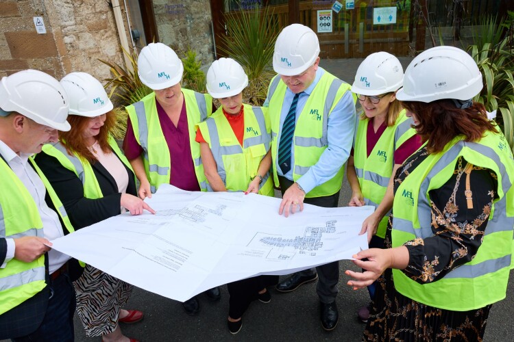 John McClintock, McLaughlin & Harvey&rsquo;s operations director, views plans with the project team and clinical staff