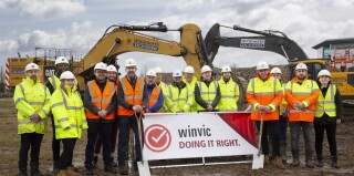 Representatives from Royal London Mutual Insurance Society, Gardiner & Theobald and Winvic Construction pose for ground breaking