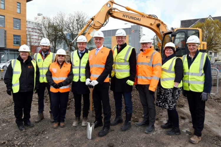 Staff from client and contractor assemble to mark ground breaking at Cornell Quarter