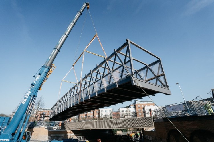 The new cycle bridge is lifted into place