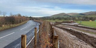The watercourse that was threatening the A5085 in Caumbria has been realigned to divert it away from the road embankment