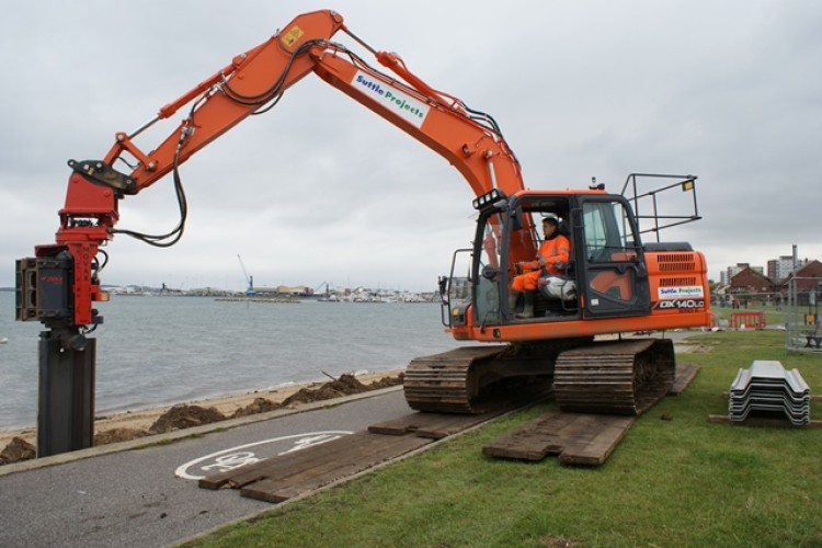 Suttle's new Doosan DX140LC-3 and, below, the sheet piles it installed at Poole 