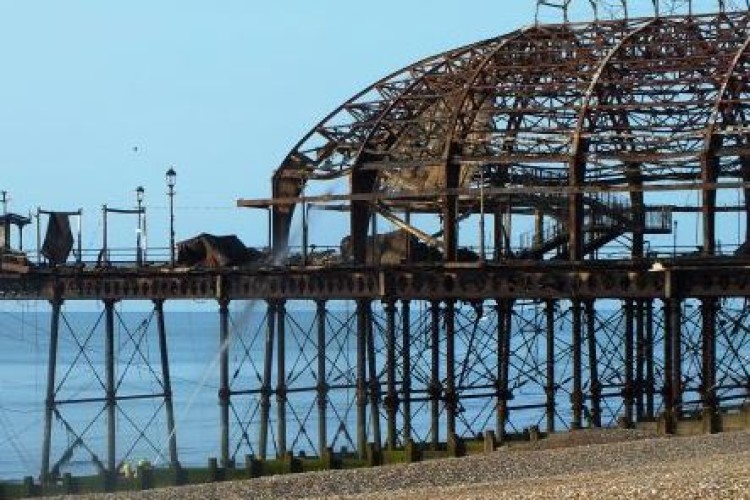 The man was working on the charred remains of Eastbourne Pier