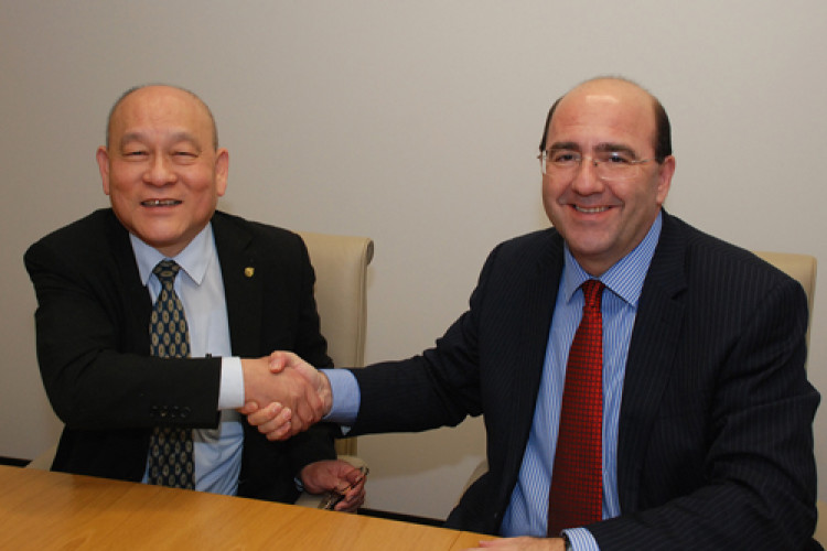 University dean Mike Kagioglou (right) welcomes BCEG director Yewcheong Lau