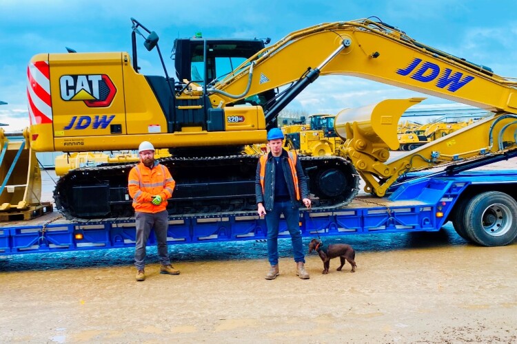 Left to right are Chris McGee (account manager at Cat dealer Finning), JDW director John Jones, and Chester 
