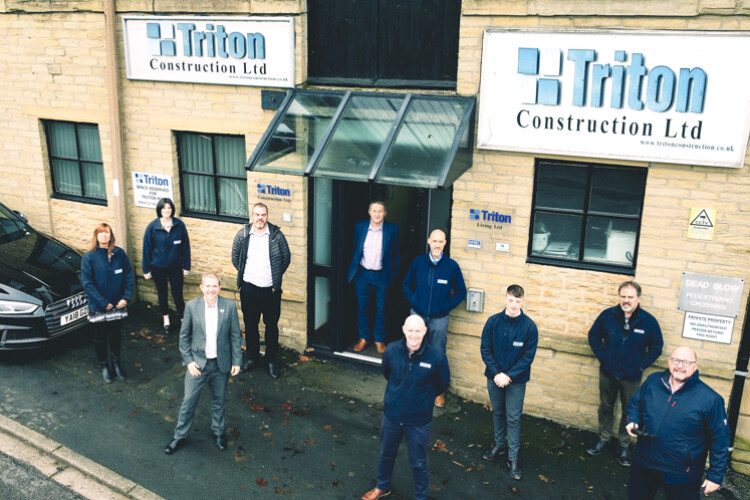 Triton MD Paul Clarkson, third from left, with some of the company's new owners 
