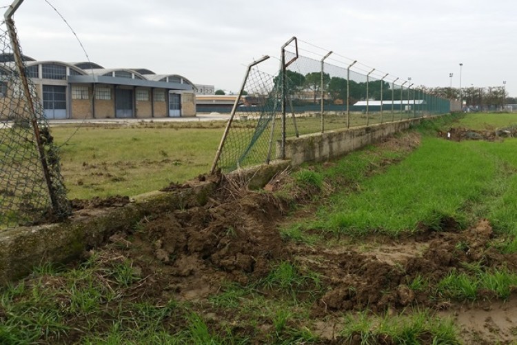 Thieves broke through this fence to steal the JCB 85Z-1