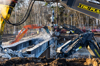 Tru7 Demolition broke out the concrete deck and then removed the heavy steel beams