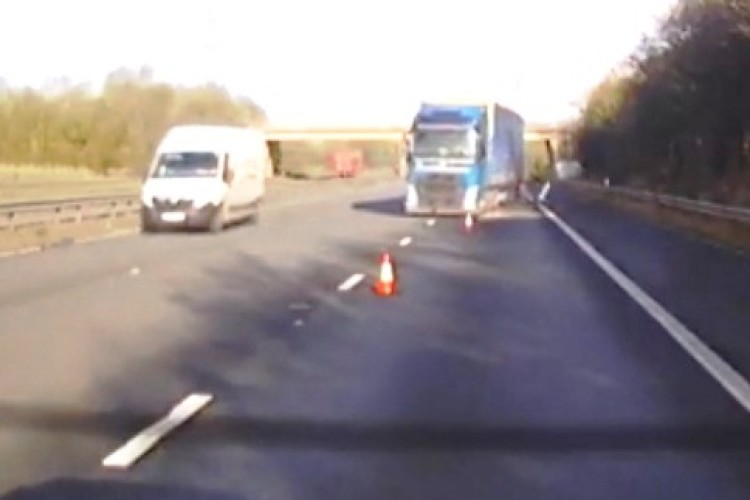 Near miss as a lorry ploughs through traffic cones