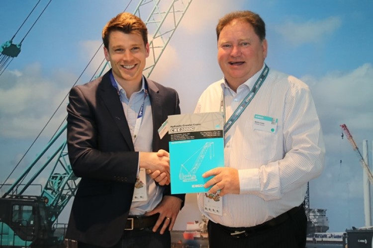 Hawks Crane Hire managing director Elliot Hawkins (left) and Kobelco Cranes sales manager Mark Evans seal the deal for Europe&rsquo;s first CKE3000G