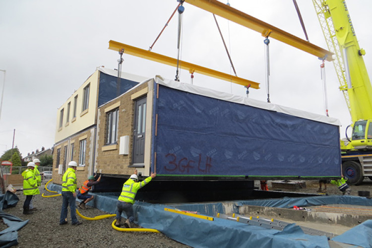 12 two-storey modular steel-framed dwellings at Bacup in Lancashire designed by the Ratcliffe Grove Partnership for Prime Structures Ltd. Photographed by Reid Lewis RIBA, project architect