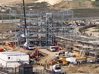 Picture shows construction of the new village centre in the third village, Castle Hill, with the rest of Whitecliffe behind