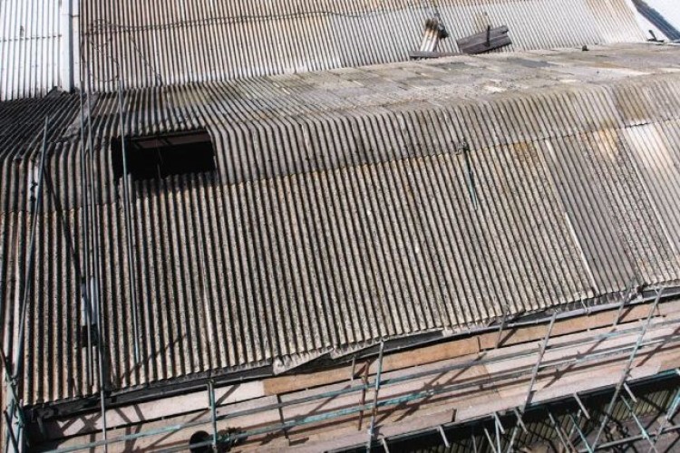 The victim fell through the corrugated asbestos cement roof