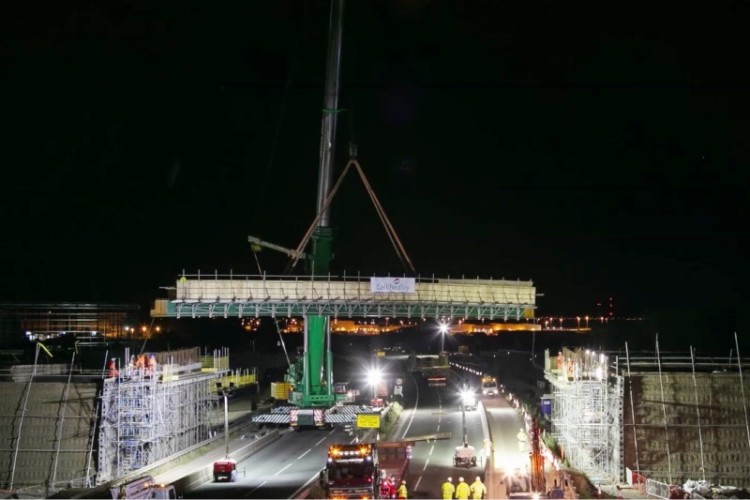 Lifting bridge beams into place