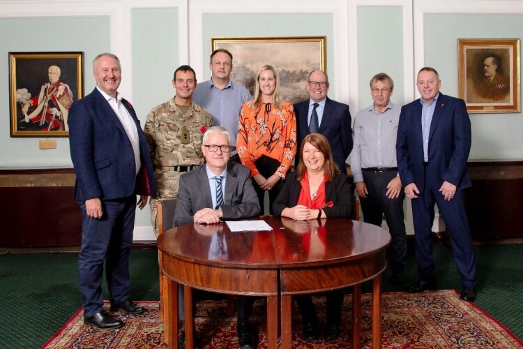 A contract signing was held in the officer’s mess at Marne Barracks in December