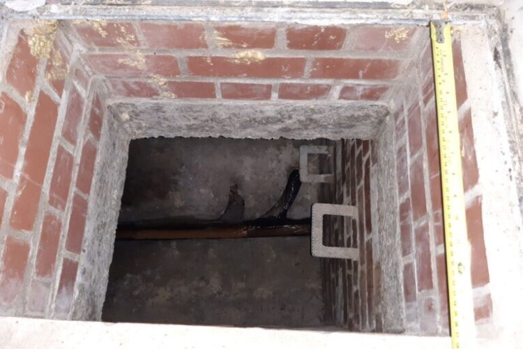 The worker was found unconscious in this chamber
