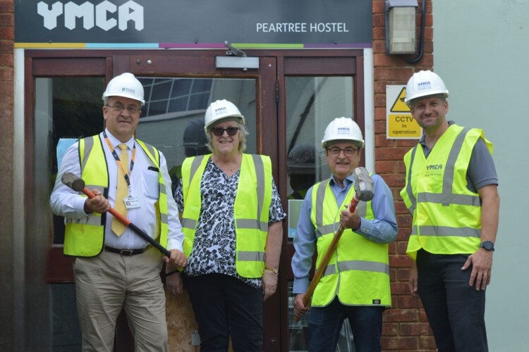 Local councillors with One YMCA chief Guy Foxall (right) prepare to help with the demolition of the former Peartree Hostel in Welwyn Garden City