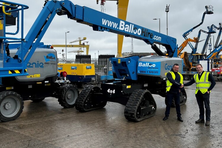 Genie sales manager Craig Duffy (left) hands over one of the new machines to Balloo Hire  powered access manager Colin Magee, 