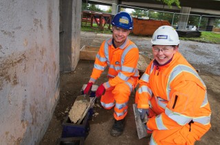Jackson trainee engineer Matthew Lees and safety adviser Karen Doherty filling cubes for testing