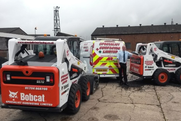  Transport manager Julian Fowles with the two new S570H skid-steer loaders