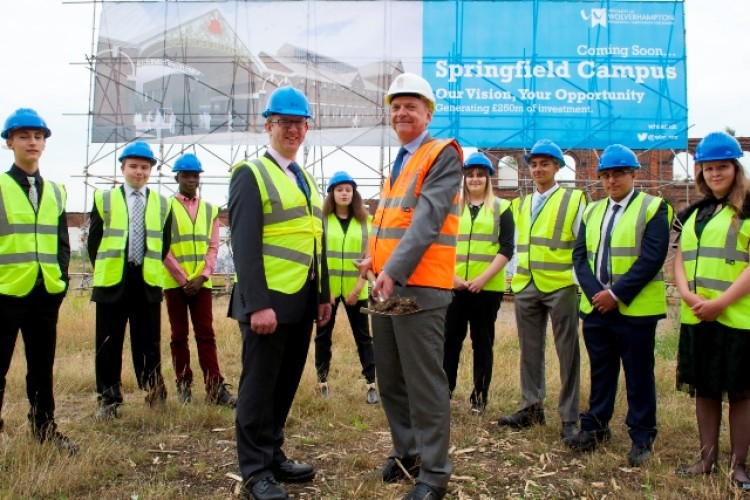 College principal Tom Macdonald and university vice-chancellor Geoff Layer lead the ground-breaking ceremony