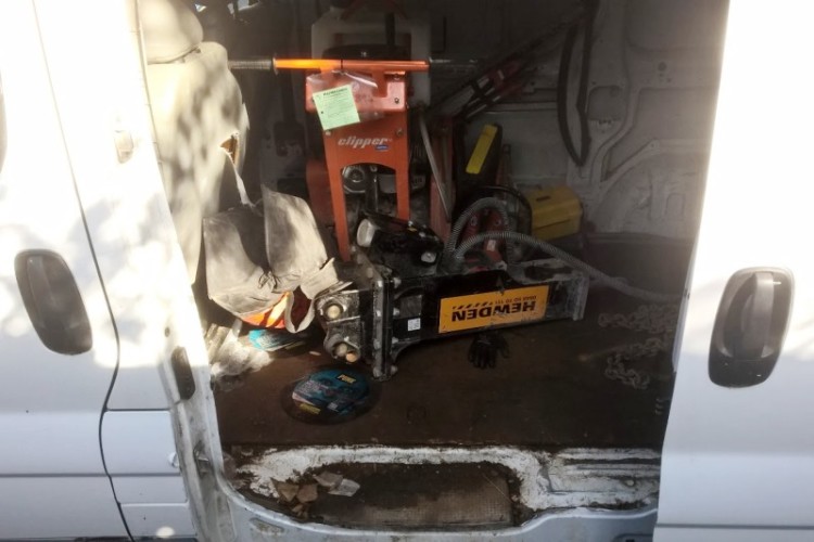 The stolen breaker attachment was found in the back of this van
