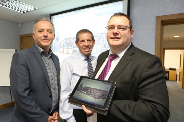 Anglesey Council&rsquo;s Gareth Thomas, Chris Wynne and Caulmert&rsquo;s Allan Smith with the BIM design software used for the Holyhead school project