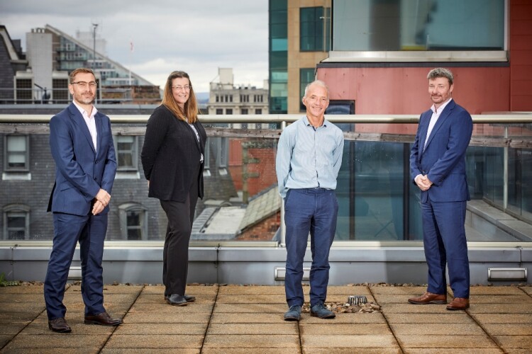 Wendy Broomhead and Ian Scott with Ridge partners Jason Howard (left) and Adrian Hickey (right) pictured on the Ridge office terrace in Manchester