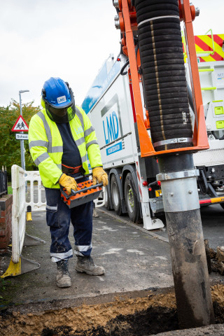 The hydraulically-operated boom at work