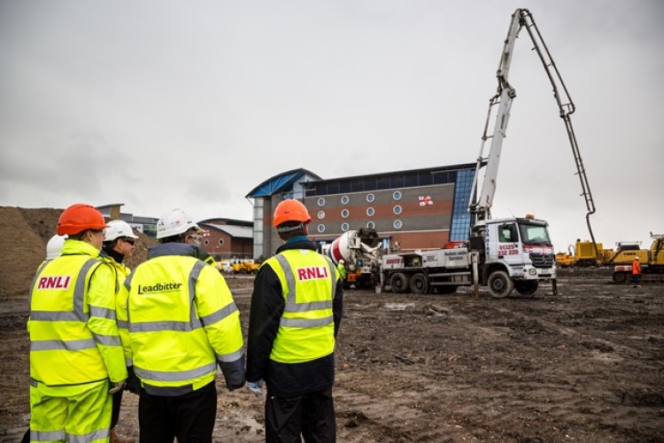 RNLI and Leadbitter staff view the site