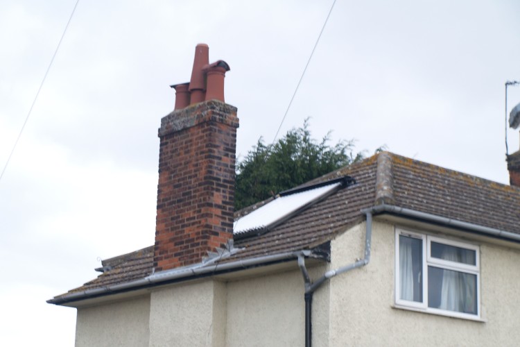 The perils of using unapproved installers are demonstrated by this panel, installed in the shadow of a chimney.