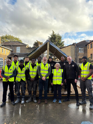 Brian Berry (fourth from left) and Annie Summun with students and staff at Shooters Hill Sixth Form college. Brian Berry (fourth from left) and Annie Summun with students and staff at Shooters Hill Sixth Form college.
