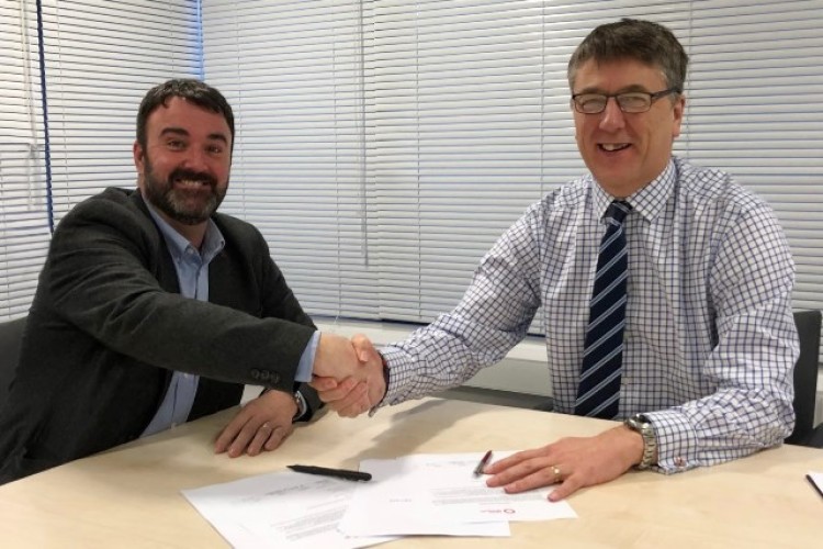 Andy Botfield and James Lees sign the paperwork 