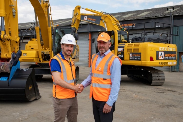 Ardent CFO Julian O&rsquo;Neill with Marubeni-Komatsu sales manager Matt Revell and two new PC210LCs