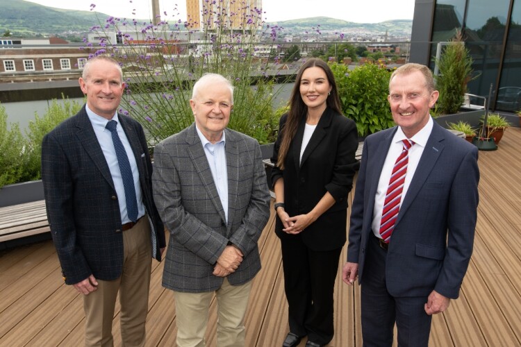  (from left) Henry Brothers director Ian McCully, Queen&rsquo;s deputy vice-chancellor Stuart Elborn, estates manager Trudy Anderson and Henry Brothers managing director David Henry