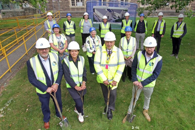 The ground breaking event was attended by representatives from Henry Brothers and the local health trust
