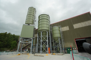Below: The powdered raw materials are stored in silos outside the plant